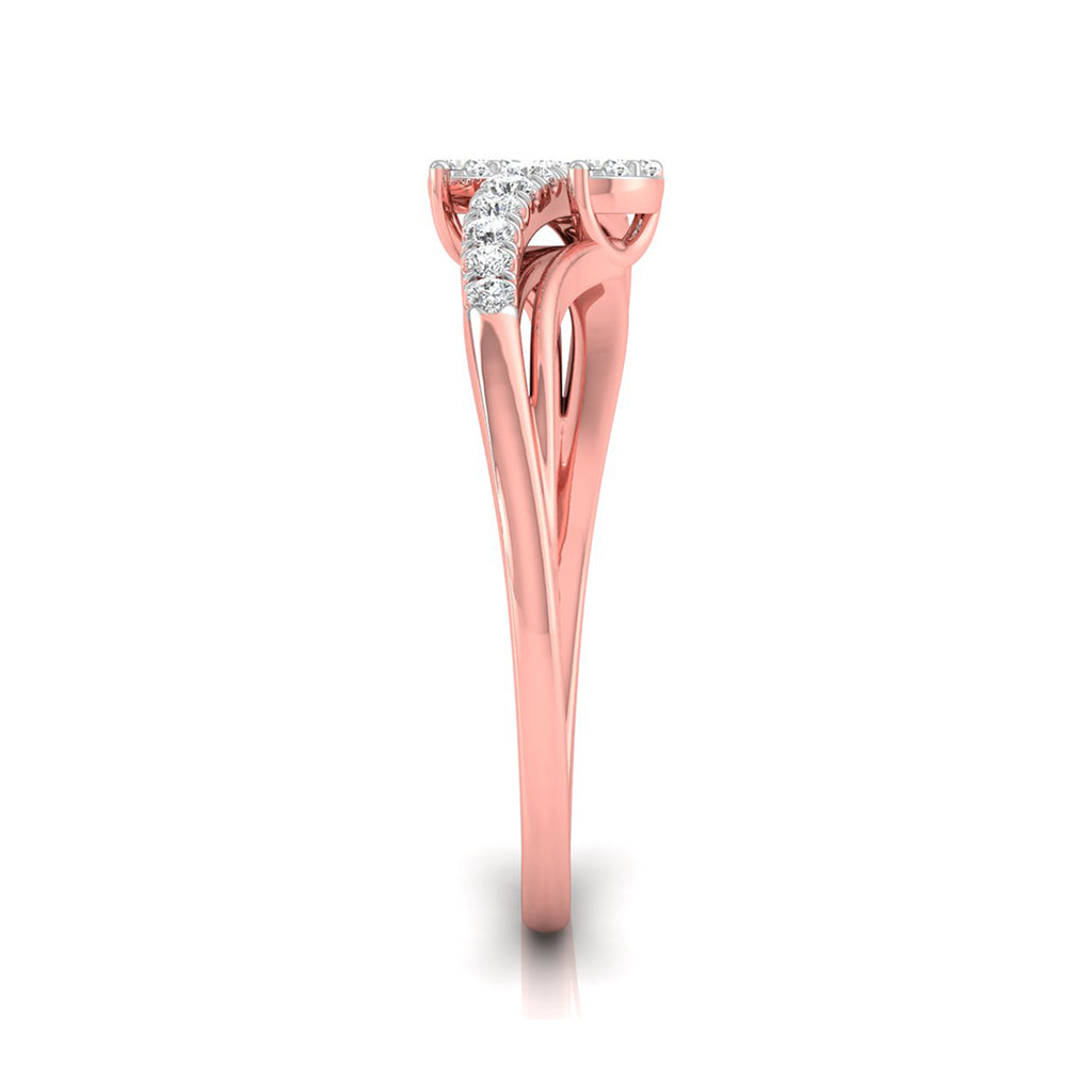 A rose gold ring with a curved, sculptural band and a small cluster of clear stones at the top, shown on a clean white background.