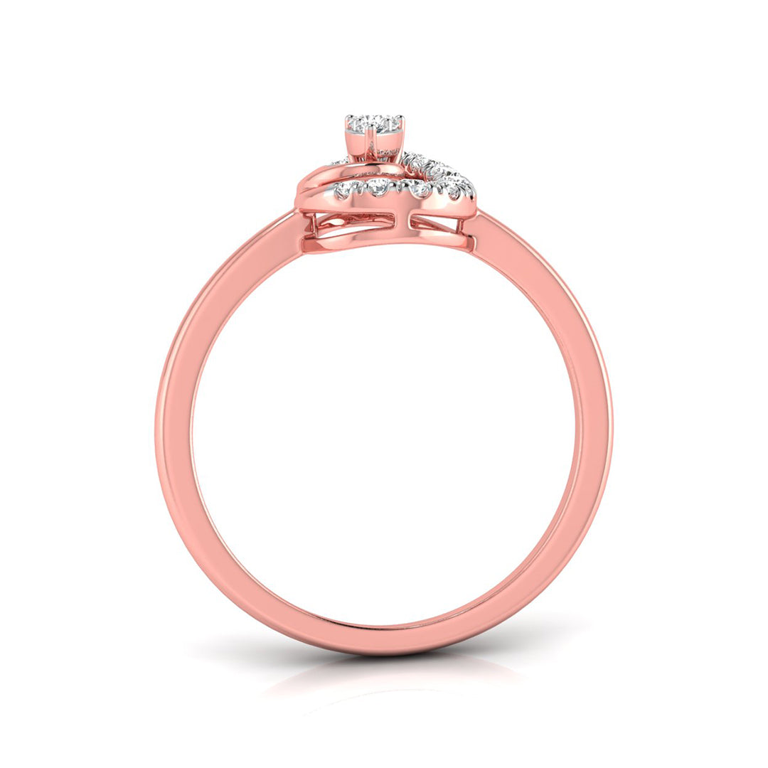 A rose gold ring with a small cluster of clear stones on the band, shown from a side angle against a white background.