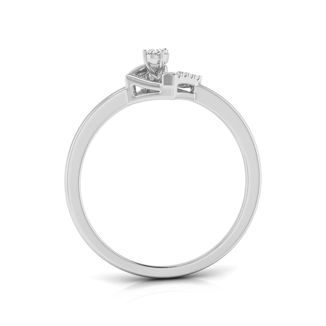 A silver-colored diamond ring with a three-stone setting, featuring a central round diamond and two smaller diamonds on the shoulders, shown on a plain white background.