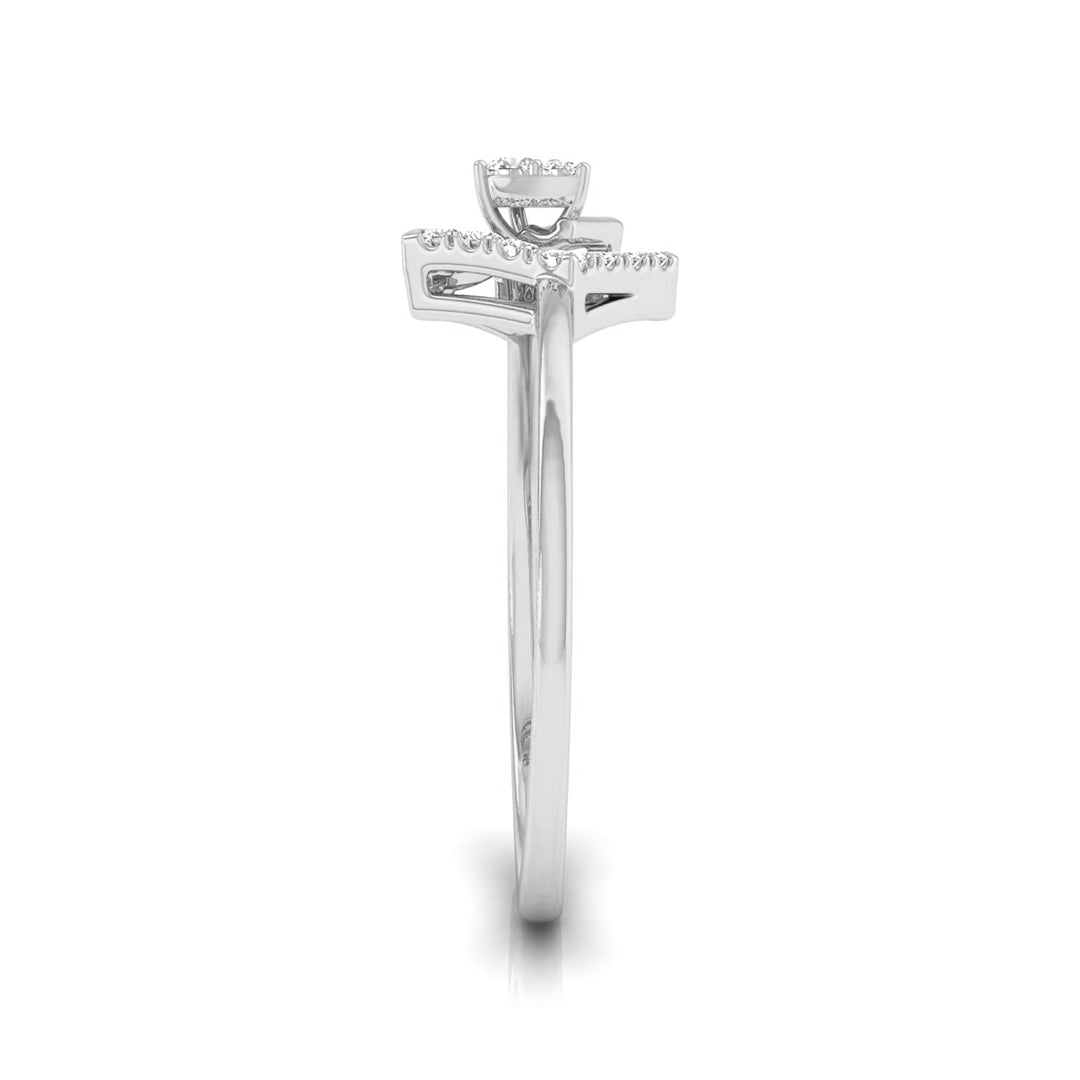 A silver-toned diamond ring shown from the side, featuring a round center stone and a row of small diamonds along the top, set against a plain white background.