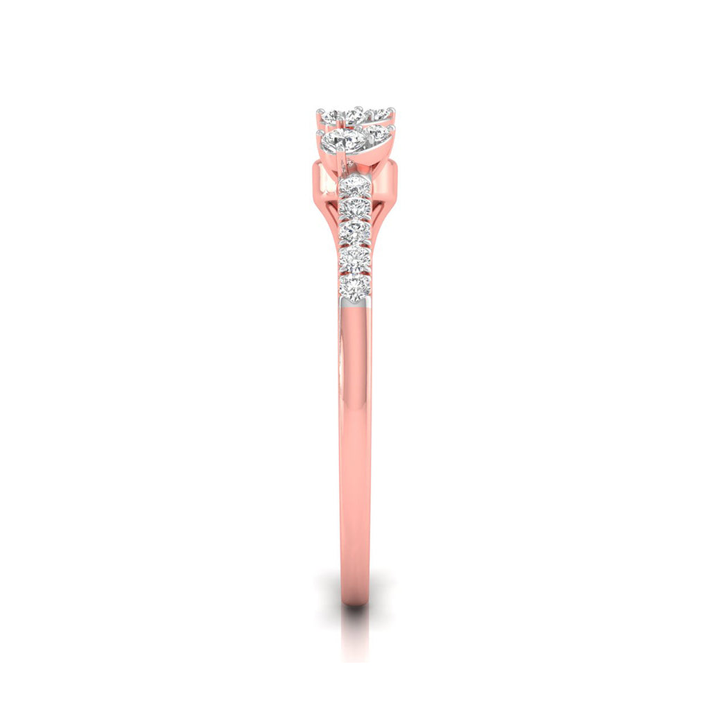 A rose gold diamond ring shown from the side on a clean white background. The ring features a round-cut diamond solitaire setting with a pavé band of smaller round diamonds along the shank.