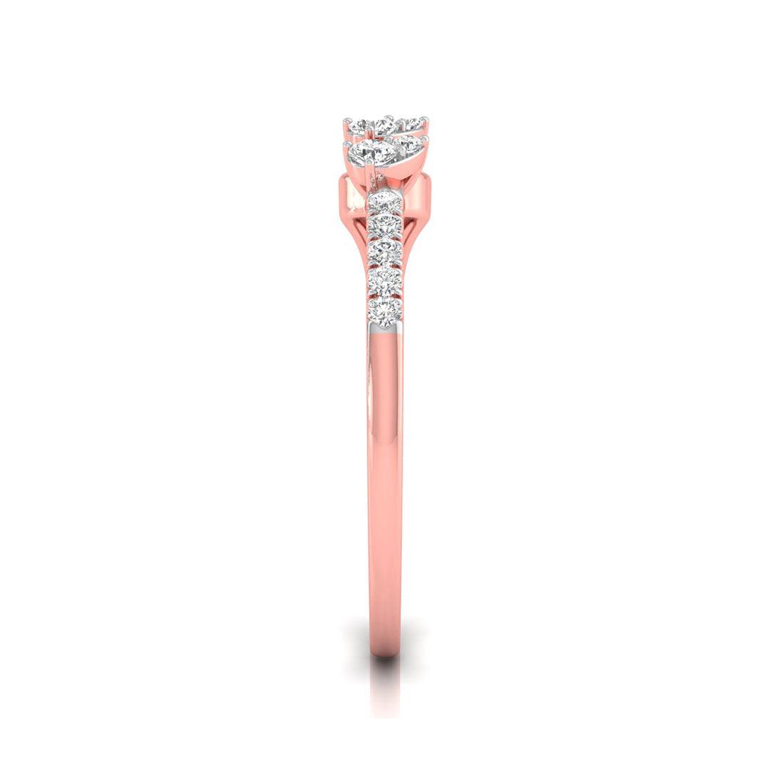 A rose gold diamond ring shown from the side on a clean white background. The ring features a round-cut diamond solitaire setting with a pavé band of smaller round diamonds along the shank.