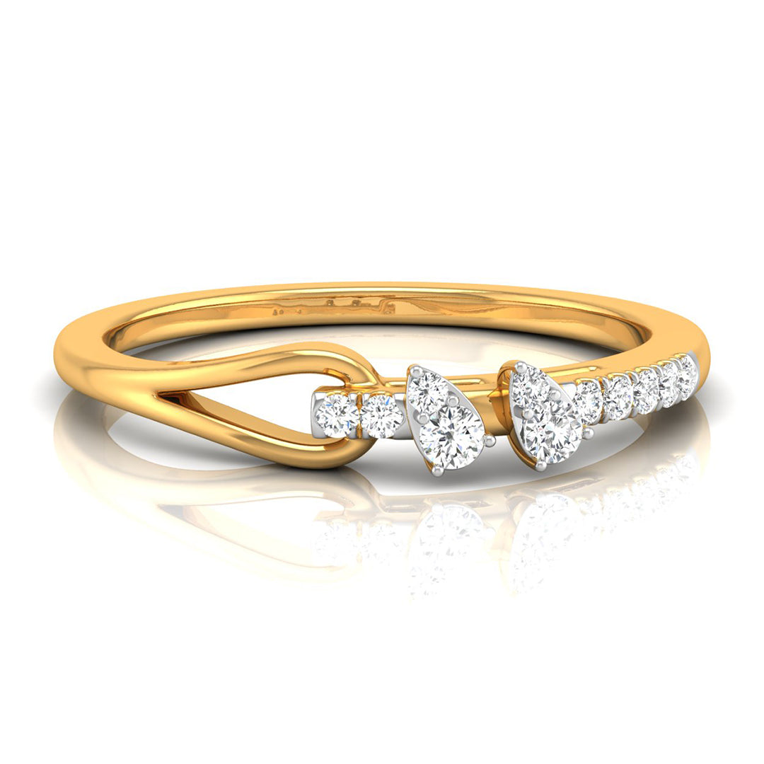 A yellow gold ring with a unique twisted band design and diamond accents, including a central marquise-cut diamond and smaller round and pear-cut diamonds, shown on a reflective white background.
