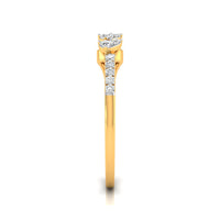 A yellow gold ring featuring a curved halo-style diamond setting at the top and a vertical row of three round diamonds on the band, shown against a plain white background.