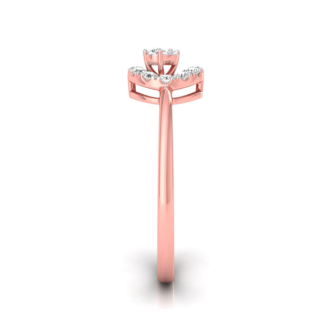 A rose gold ring with a floral crown setting featuring small clear stones, shown on a clean white background with a soft shadow.