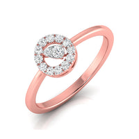 A rose gold ring featuring a circular halo design set with clear round and marquise-cut gemstones, shown on a clean white background.