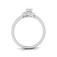 A white gold or platinum engagement ring featuring a round center stone and a small halo of round side stones, shown from a top-down view on a white background.