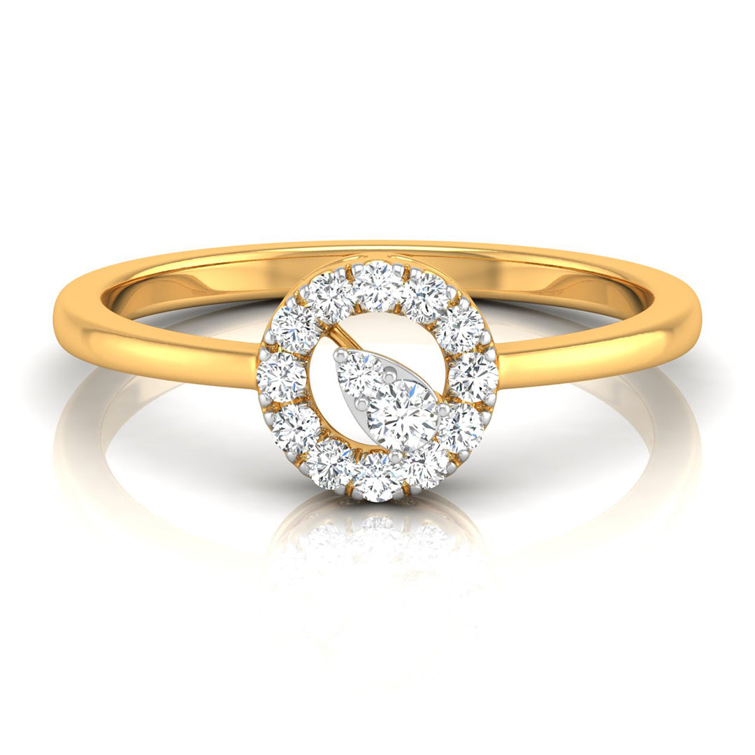 A yellow gold ring with a double halo design featuring round and marquise-cut clear stones, shown on a reflective white surface.
