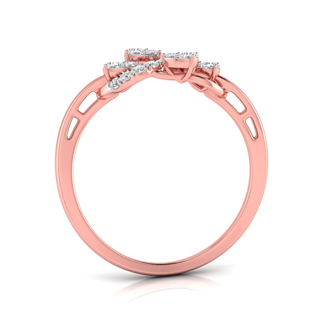 A rose gold ring with a bow-shaped cluster of small clear gemstones at the top, shown on a clean white background with a soft reflection.