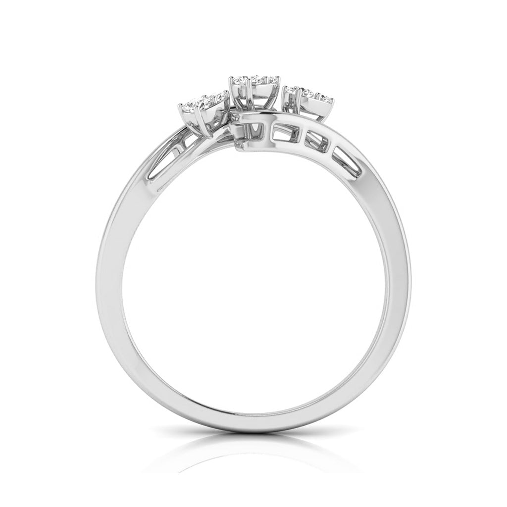 A silver-colored diamond ring with three small round-cut diamonds set in a split shank design, shown on a clean white background with a soft reflection. white gold