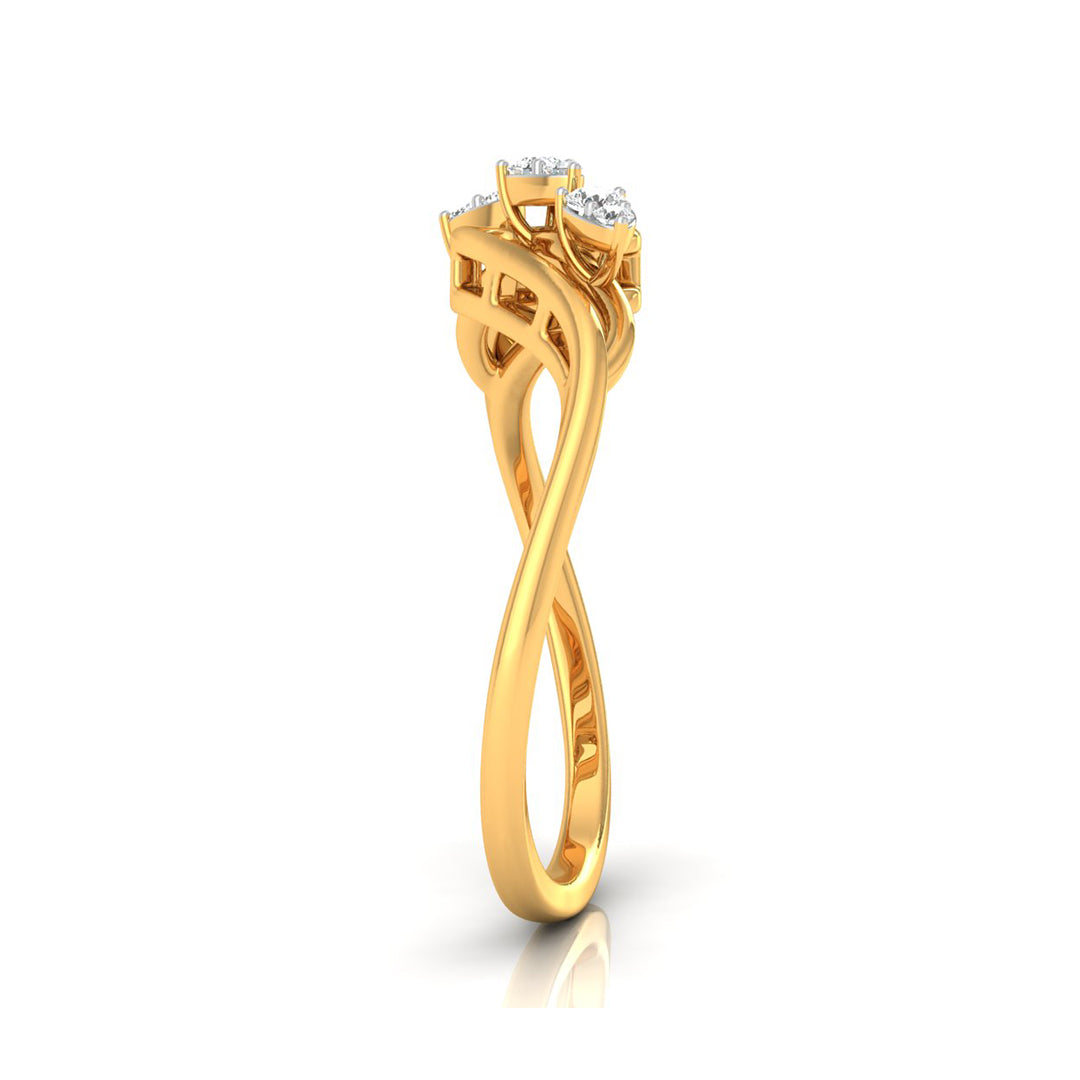 A yellow gold ring with a twisted infinity-style band and a three-stone crown set with clear gemstones, shown on a white background with a soft reflection.
