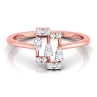 A rose gold ring with a geometric design featuring multiple clear round and pear-cut gemstones, shown on a clean white background with a soft reflection.