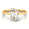 A yellow gold ring with a geometric diamond cluster setting, featuring pear-cut and round-cut diamonds on a clean white background with a soft reflection.