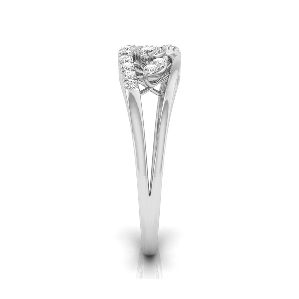 A silver-toned diamond ring with a heart-shaped cluster of small diamonds on a white background. white gold