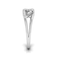 A silver-toned diamond ring with a heart-shaped cluster of small diamonds on a white background. white gold