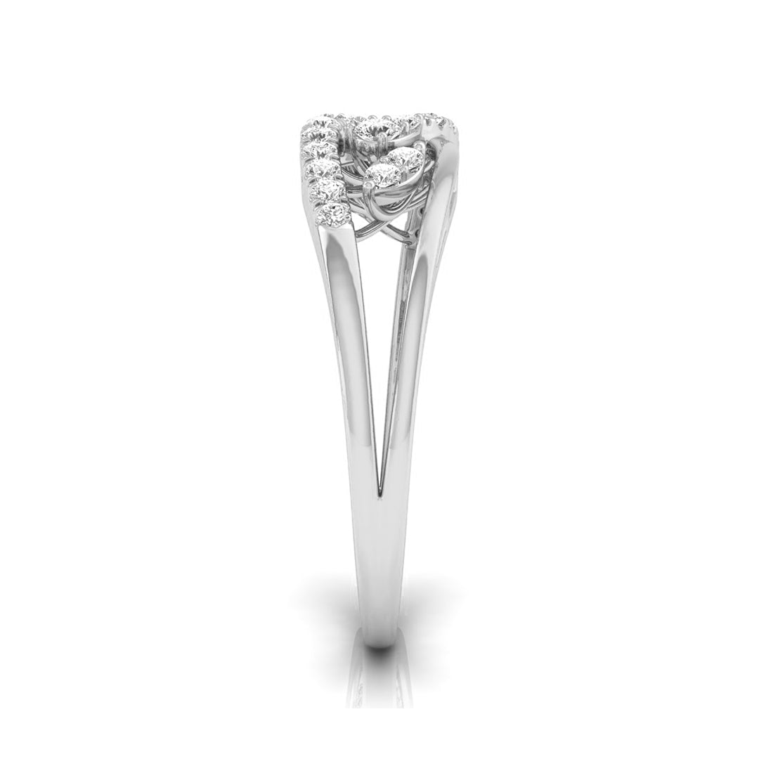 A silver-toned diamond ring with a heart-shaped cluster of small diamonds on a white background. white gold