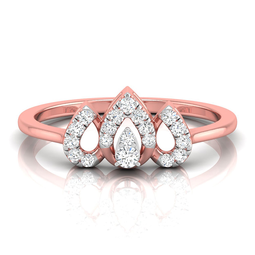 A rose gold ring featuring a central pear-cut diamond surrounded by smaller diamonds, flanked by two teardrop-shaped diamond clusters on a polished rose gold band, shown on a white reflective surface.