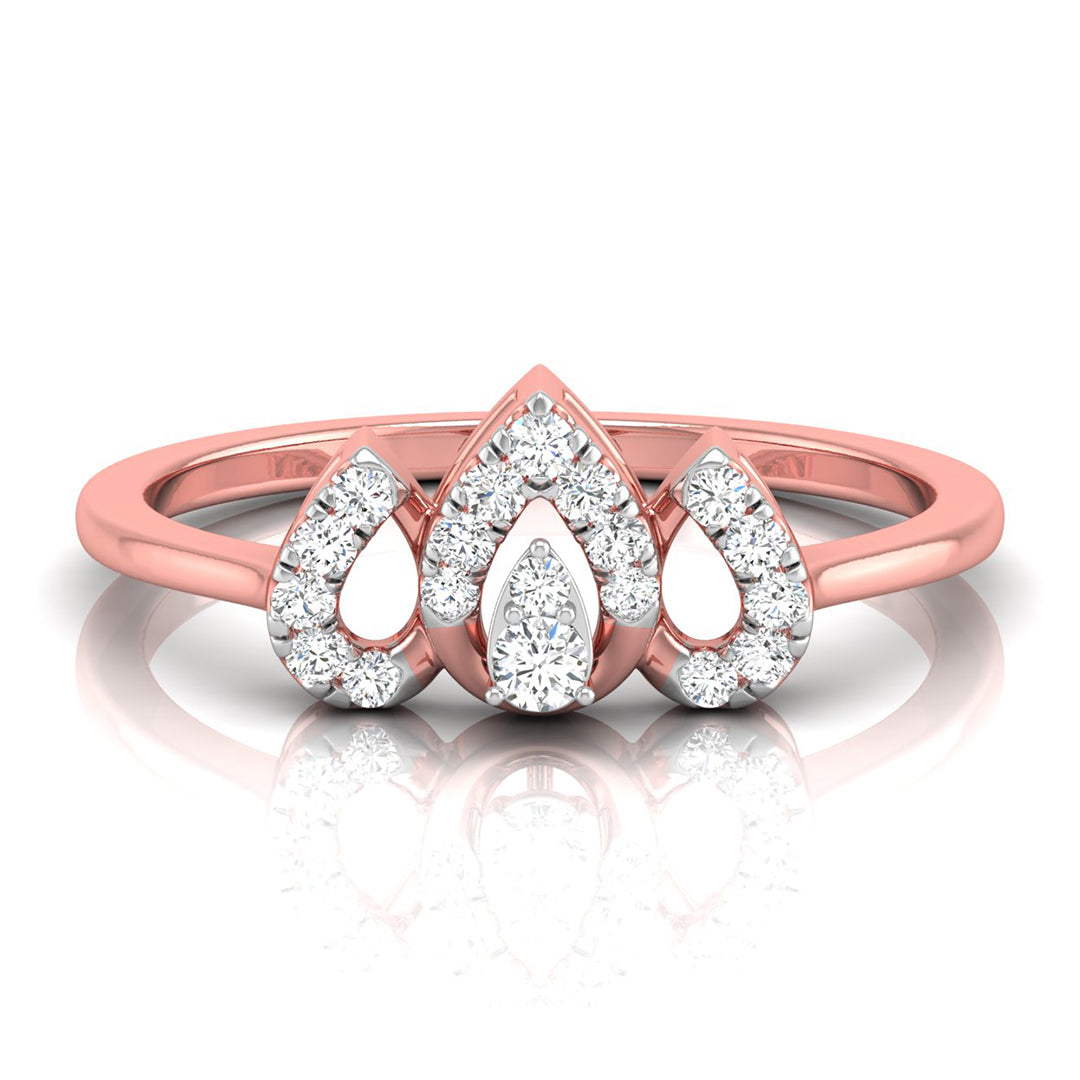 A rose gold ring featuring a central pear-cut diamond surrounded by smaller diamonds, flanked by two teardrop-shaped diamond clusters on a polished rose gold band, shown on a white reflective surface.