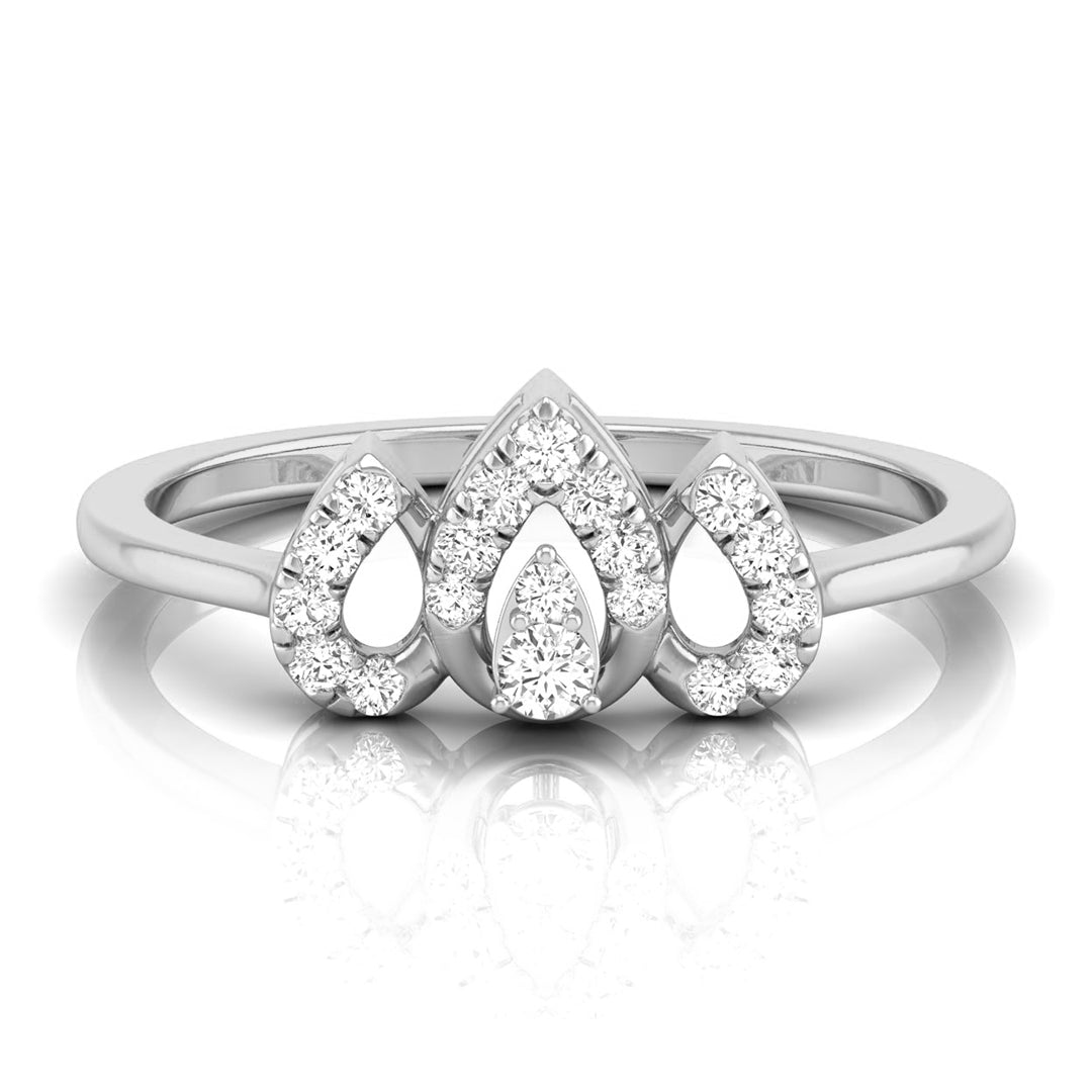 A silver three-stone diamond ring featuring pear-cut and round diamonds in a pavé setting, displayed on a clean white background with a soft reflection. white gold