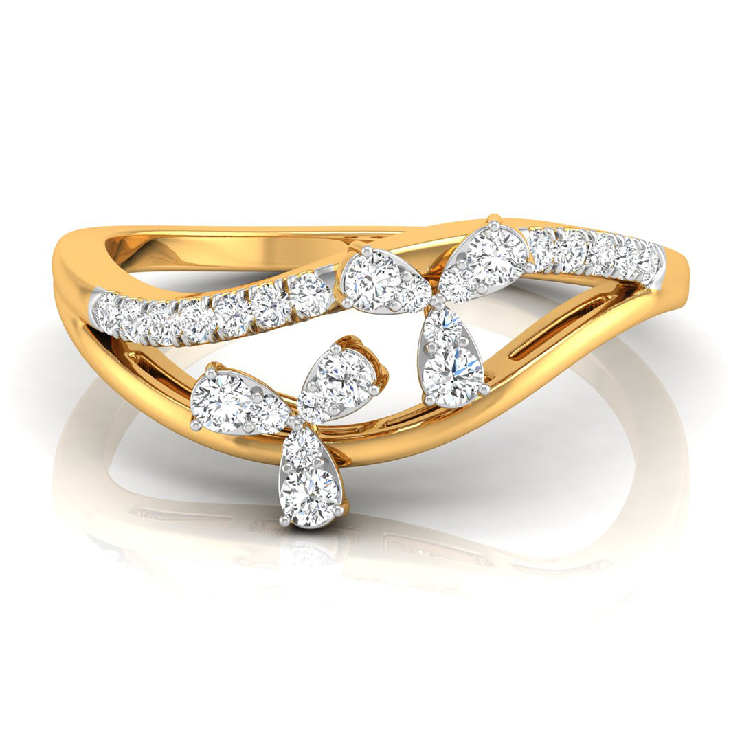 A yellow gold ring featuring a flowing, wave-like band adorned with multiple clear gemstones, including pear-shaped and round-cut stones set in white metal, shown on a reflective white background. yellow gold