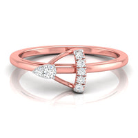 A rose gold ring with a geometric design featuring a pear-cut diamond on the left and a curved bar of round diamonds on the right, set against a clean white background with a soft reflection.