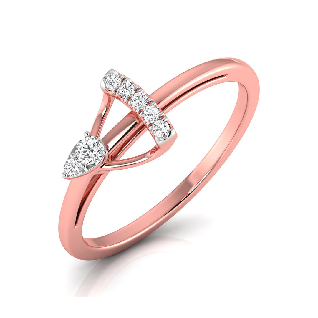A rose gold ring with a pear-cut diamond and a pavé-set row of round diamonds, shown on a clean white background.