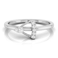 A white gold or platinum ring featuring a split design with a pear-cut diamond on one side and a curved bar of round diamonds on the other, set against a clean white background with a soft reflection. white gold