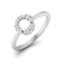 A silver-tone ring featuring a circular open center pavé-set with small clear gemstones, shown on a clean white background with a soft reflection. white gold