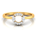 yellow Gold ring with a diamond halo on a white background