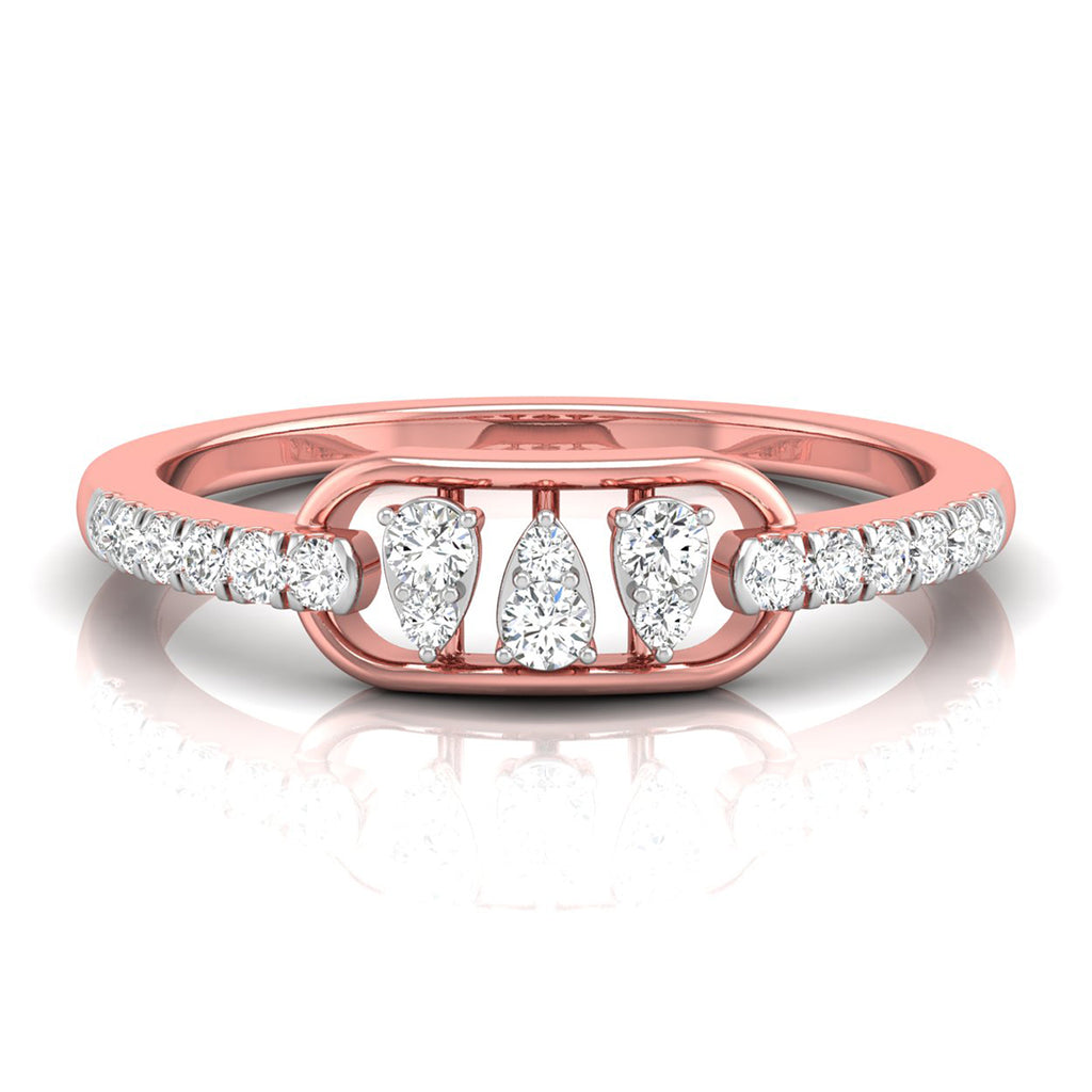 A rose gold ring featuring three central pear-cut diamonds flanked by smaller round diamonds on the band, set against a clean white background with a soft reflection.