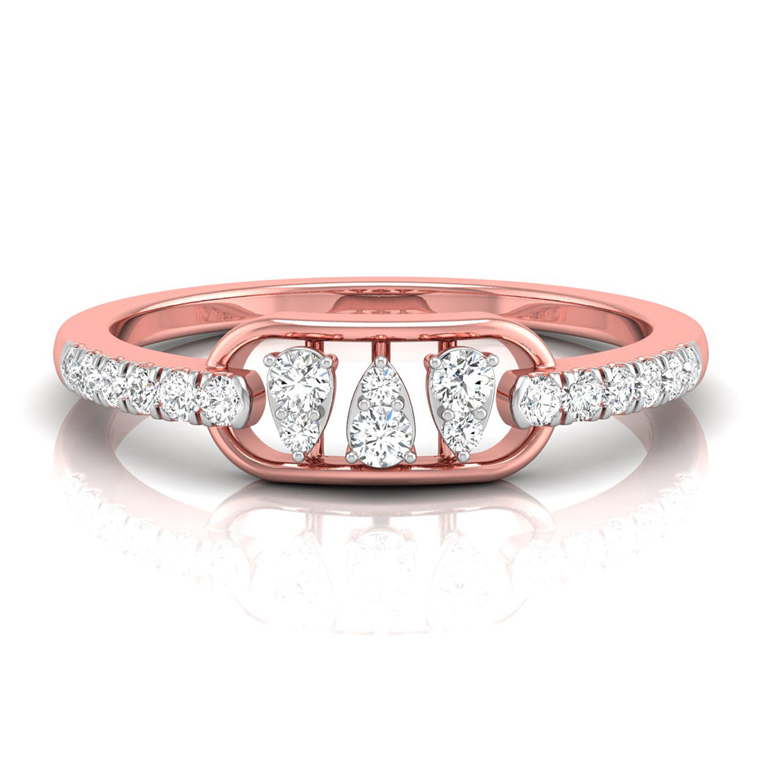 A rose gold ring featuring three central pear-cut diamonds flanked by smaller round diamonds on the band, set against a clean white background with a soft reflection.