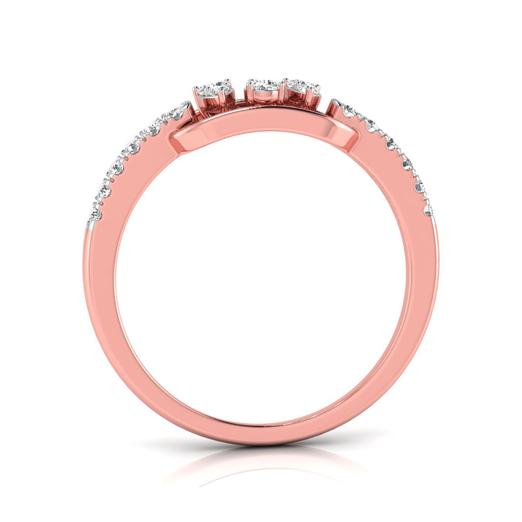 A rose gold ring with a pavé band and three round-cut clear gemstones on the top, shown against a plain white background.