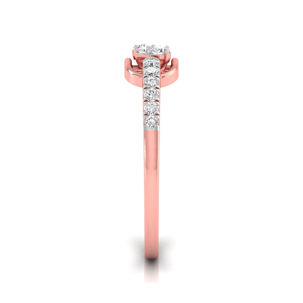 A rose gold diamond ring shown from a top-down view on a white background. The ring features a round-cut diamond center stone in a prong setting, with a pavé band of smaller round diamonds extending down the shank.