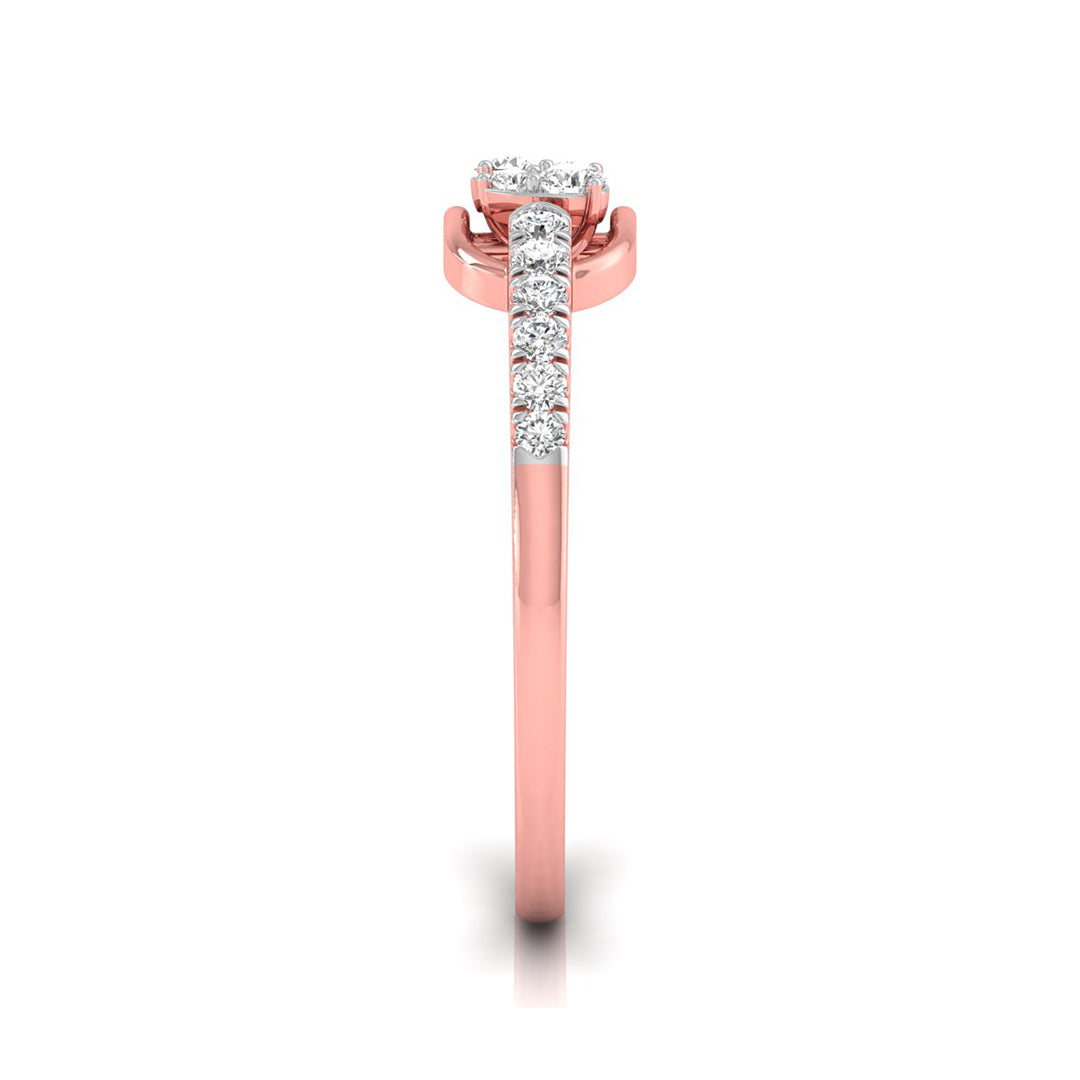 A rose gold diamond ring shown from a top-down view on a white background. The ring features a round-cut diamond center stone in a prong setting, with a pavé band of smaller round diamonds extending down the shank.