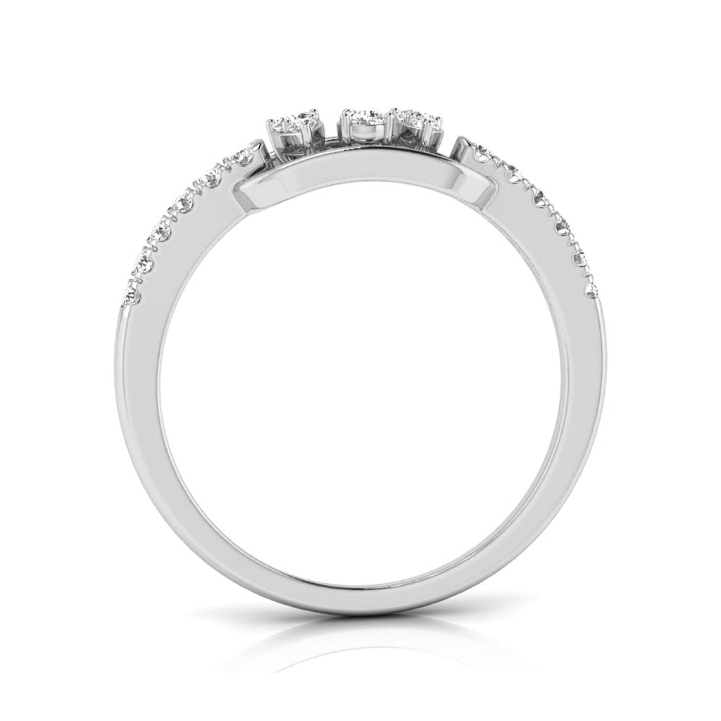 A silver-toned diamond ring shown from a top-down view, featuring three round-cut diamonds in the center and a row of smaller pavé diamonds along the shoulders, set against a clean white background. white gold