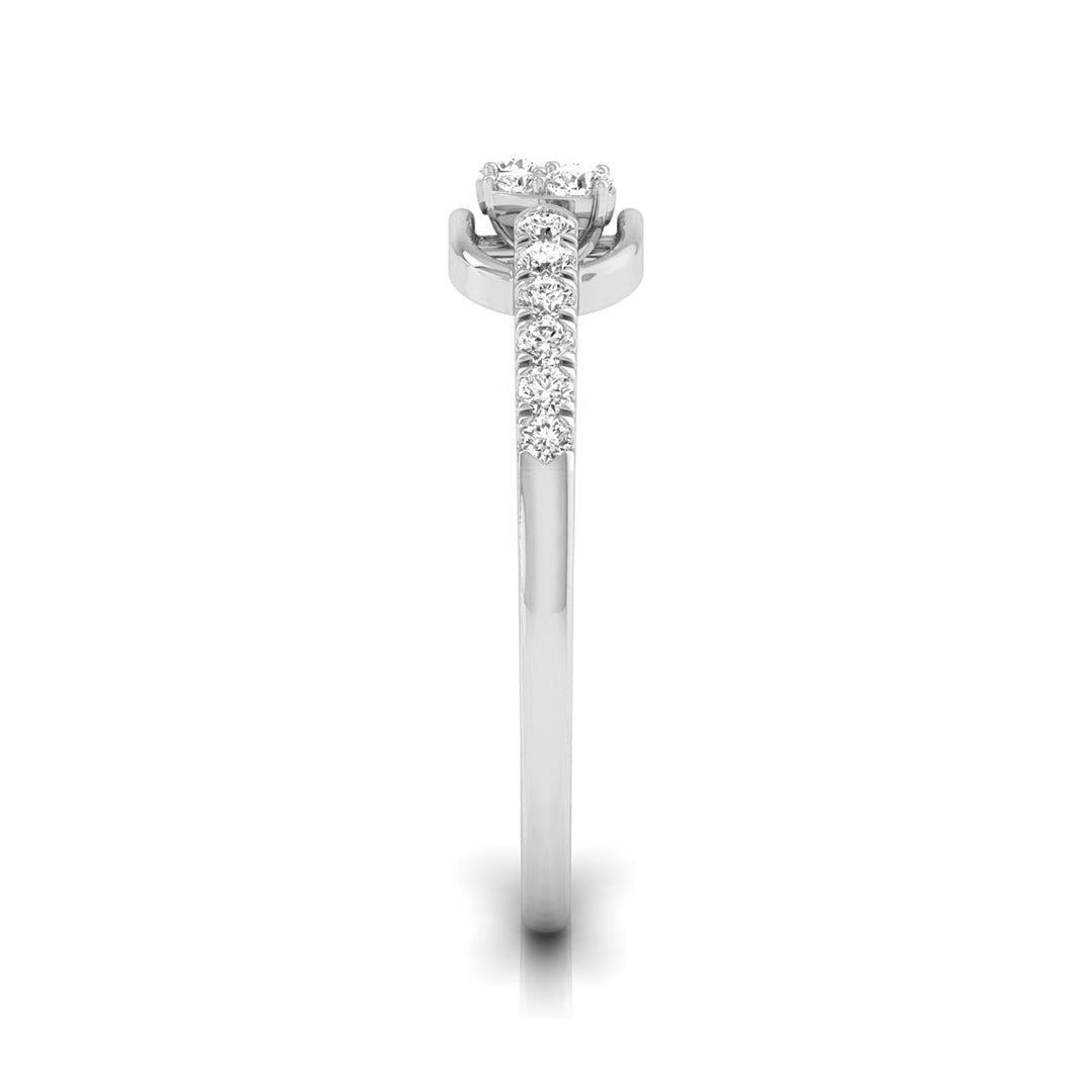 A silver-toned diamond ring with a three-stone round center and a pavé band, shown on a plain white background. white gold