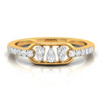 A yellow gold ring featuring three central pear-cut diamonds flanked by smaller round diamonds on the band, set against a clean white background with a soft reflection.