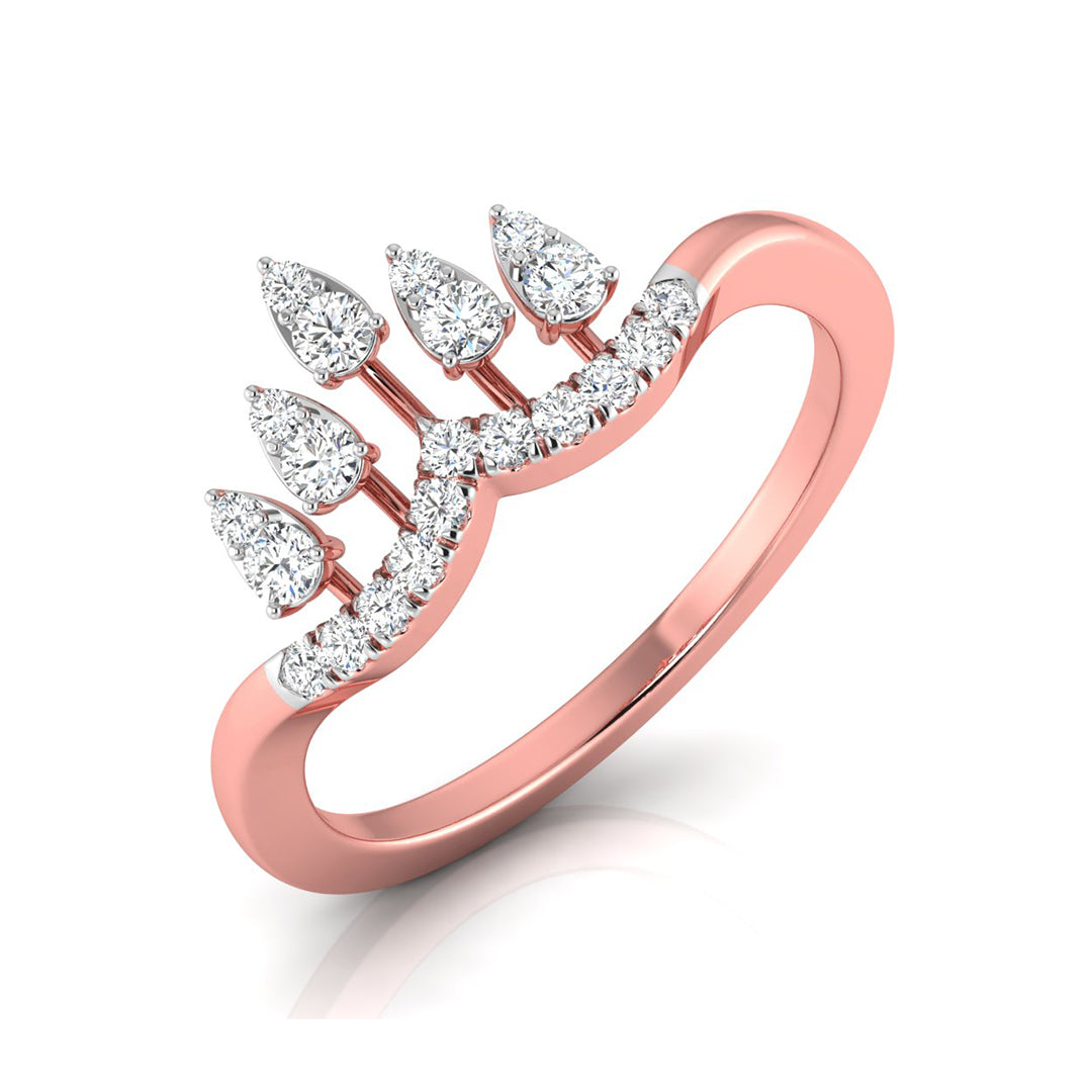 A rose gold ring featuring a crown-like top set with pear-cut and round brilliant-cut diamonds, shown on a clean white background with a soft reflection.