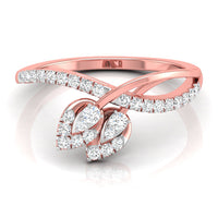 A rose gold ring with a leaf-shaped pavé setting featuring round and marquise-cut diamonds, shown on a clean white background with a soft reflection.