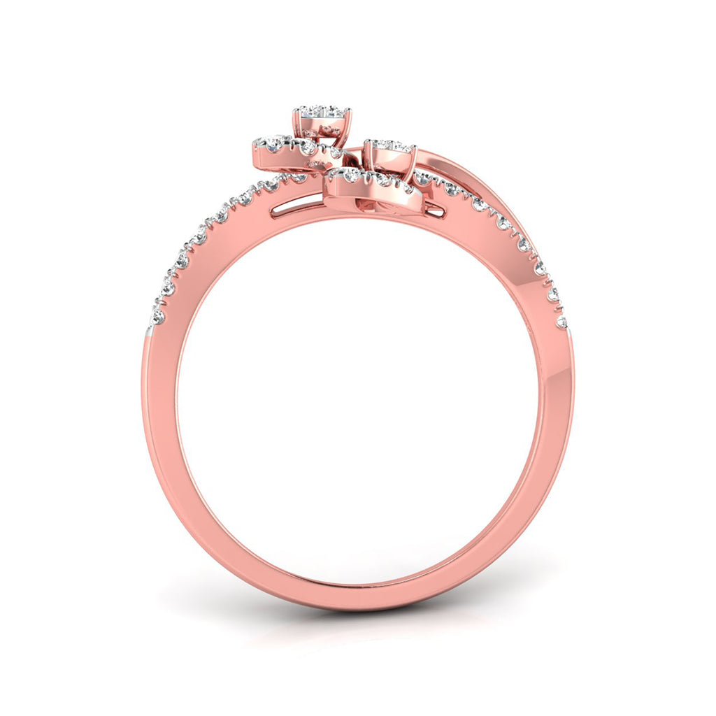 A rose gold ring with a pavé diamond band and a three-stone cluster setting on top, shown from a side angle on a white background.