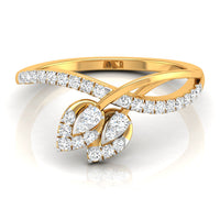 A yellow gold bypass ring featuring two leaf-shaped clusters set with round and pear-cut diamonds, shown on a clean white background with a soft reflection.