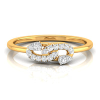 A yellow gold ring featuring a double-helix design paved with round and pear-cut diamonds, set against a clean white background with a soft reflection.