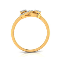 A yellow gold ring with a cluster of small clear gemstones at the top, shown from a side angle on a white background with a soft reflection.